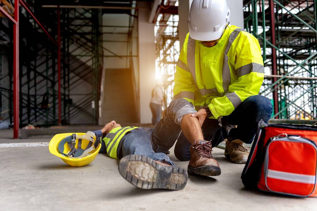 First Aid Support Accident At Work Of Construction Worker At Sit